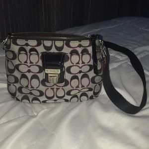 Woman’s vintage black coach purse